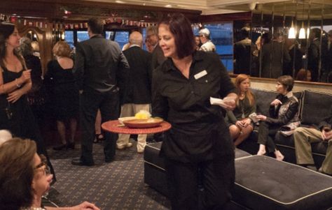 Hostess Serving Guests at Yacht Fundraiser Event in Jacksonville